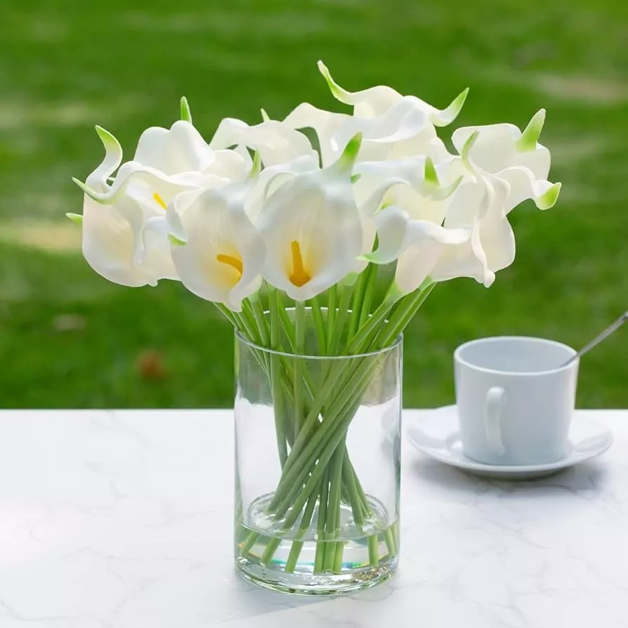 Clear glass vase being filled with fresh water for flower arrangement